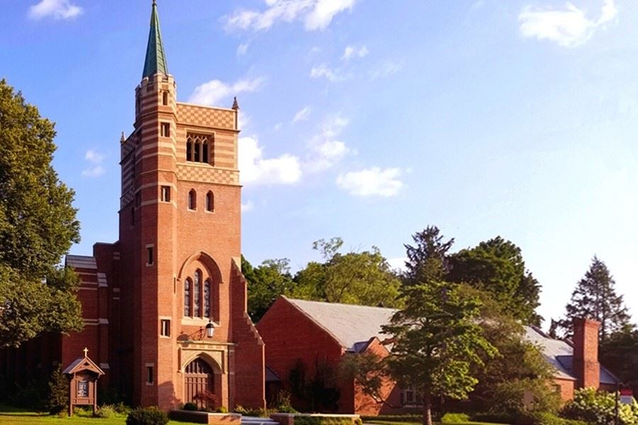 Photo of the tower and brick exterior of the Parish of the Epiphany in Winchester, MA